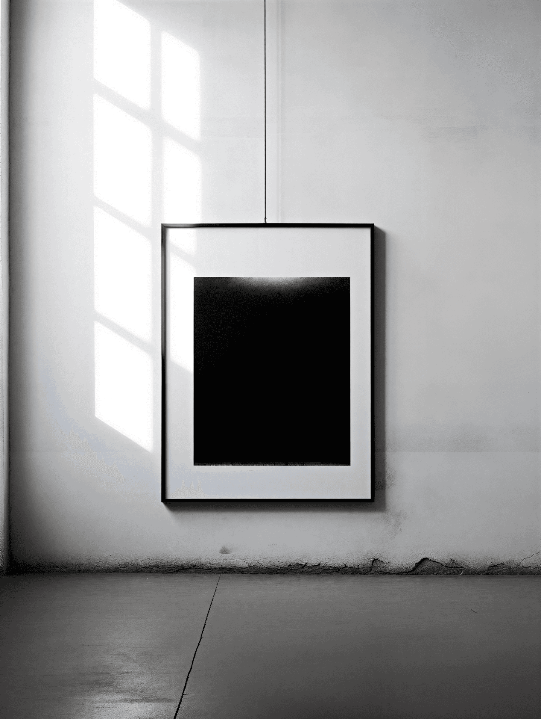 Spacious room with large black-framed windows, modern lounge chair, polished floors, and natural woodland views