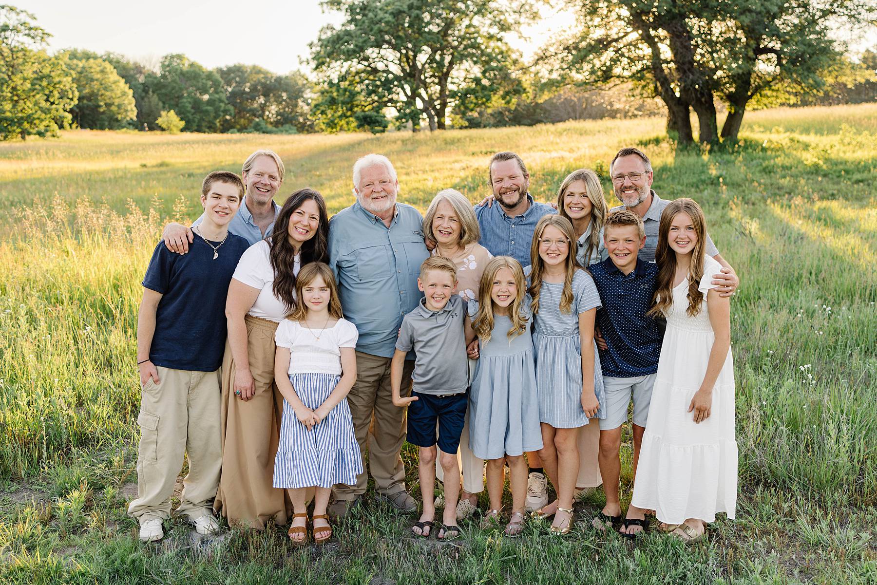 Large happy family in a field