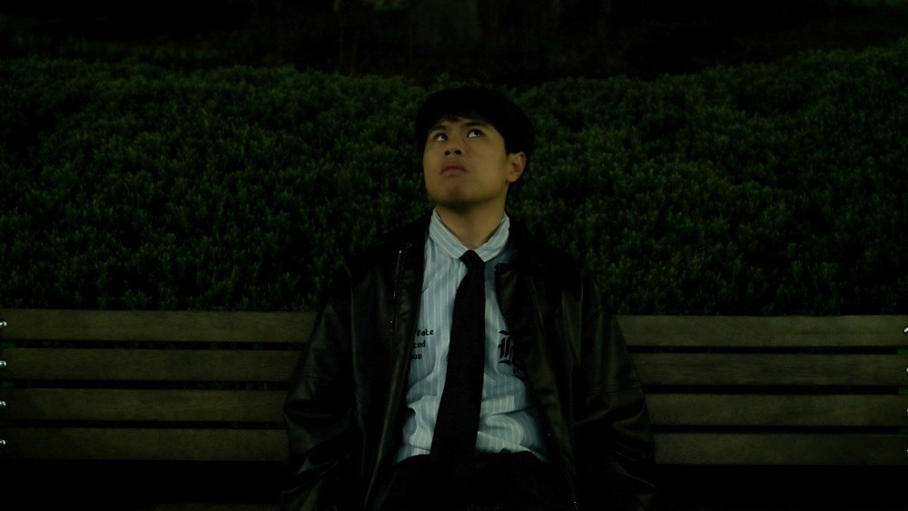 man relaxed on bench