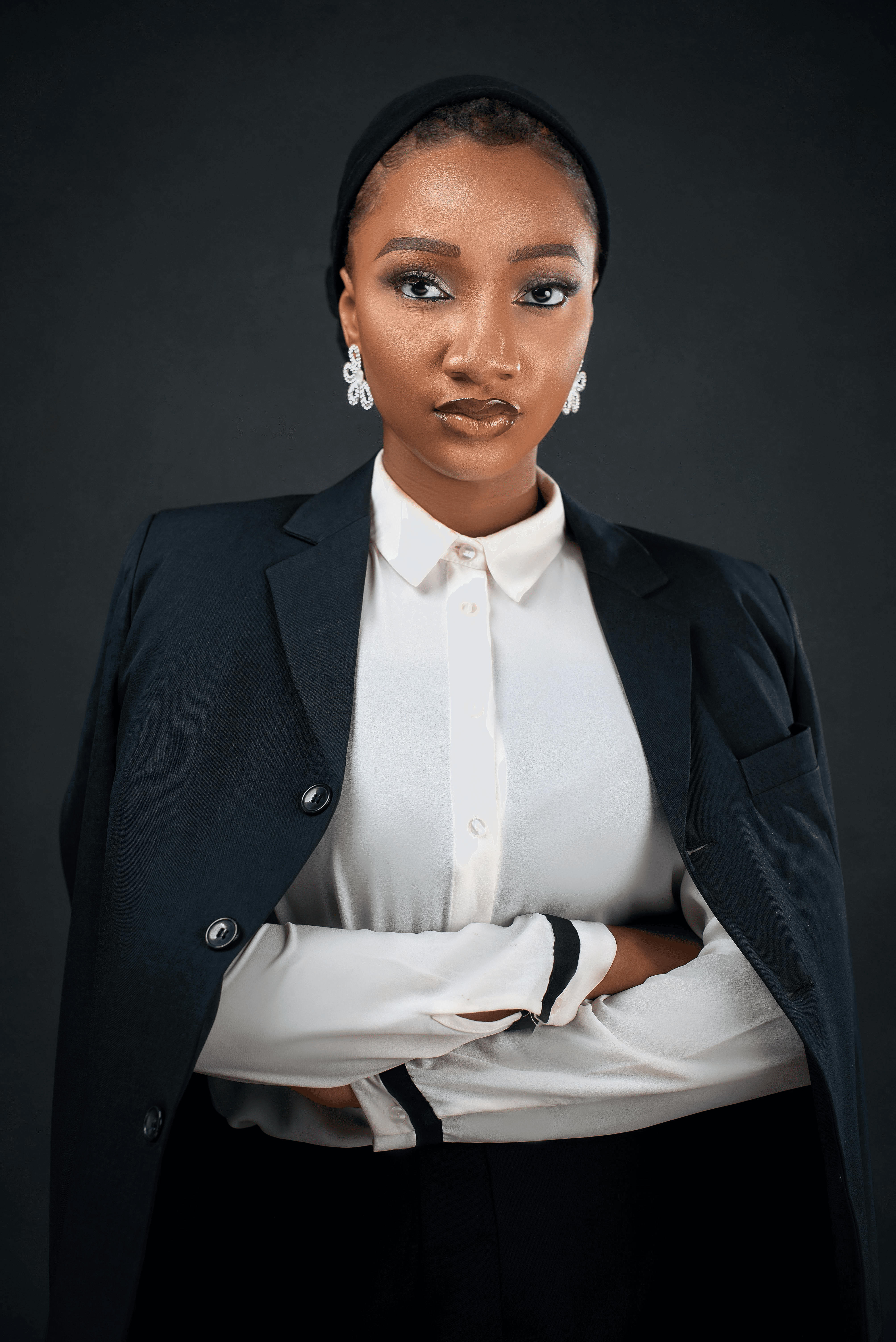 woman in brown coat using macbook air