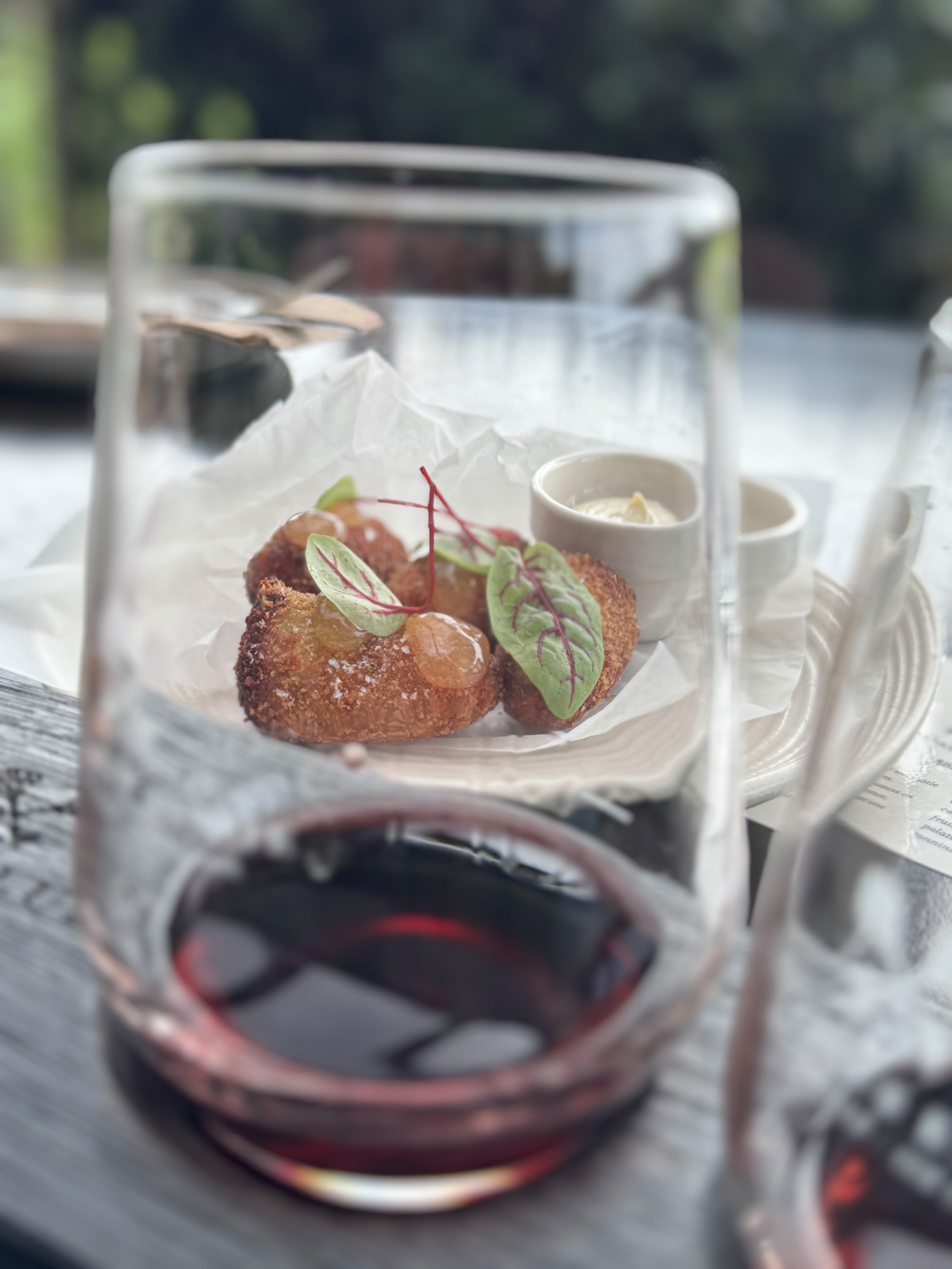Wine and food framed together at Tantalus Vineyards, Waiheke Island