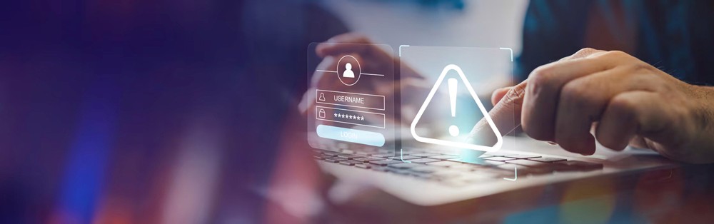 Red digital warning symbol glowing on a circuit board interface, representing active ransomware exploitation of the VMware ESXi CVE 2025 22225 vulnerability and hypervisor compromise.