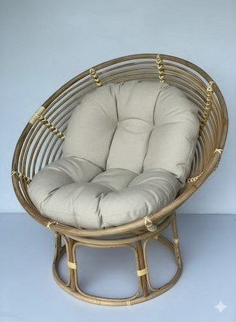 Handwoven cane lounge chair with soft seat cushion