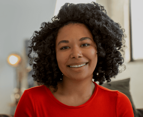 A woman in red smiling