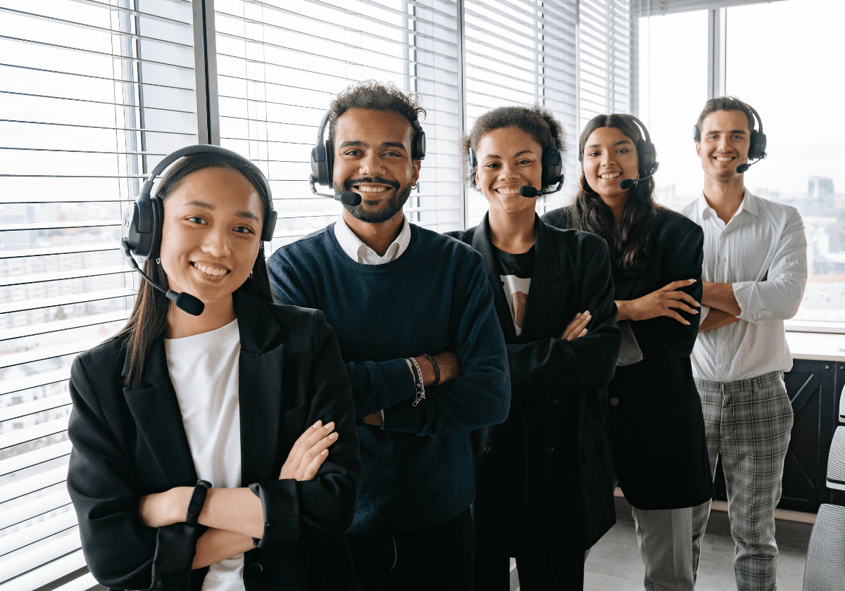 Aerial view of a winding road cutting through rocky terrain and sandy landscape.