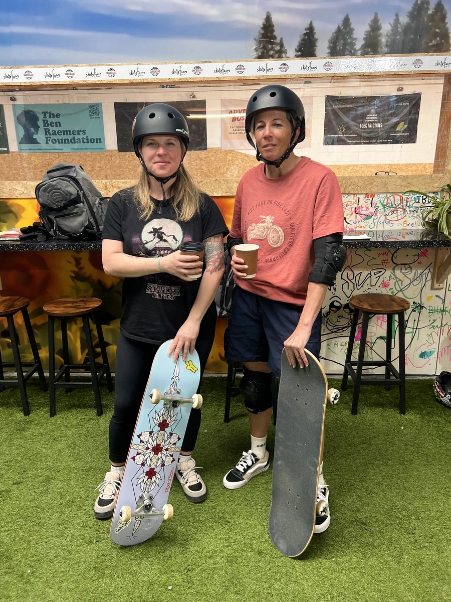 Girls skating together during a Sunday girls-only session at The Skate Farm indoor skatepark in Sussex