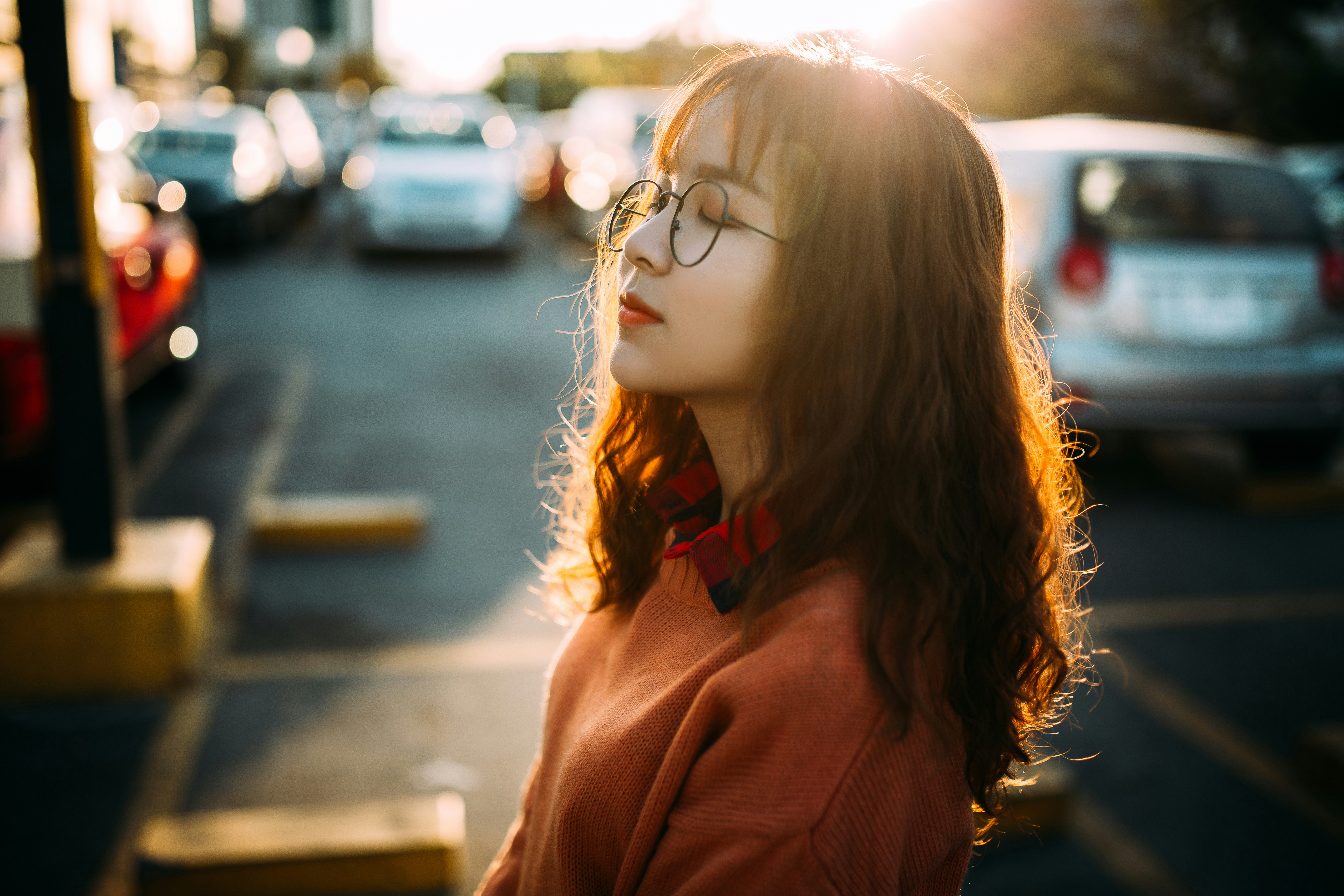 woman with glasses on the road - Cool Skin Tone Colors To Wear