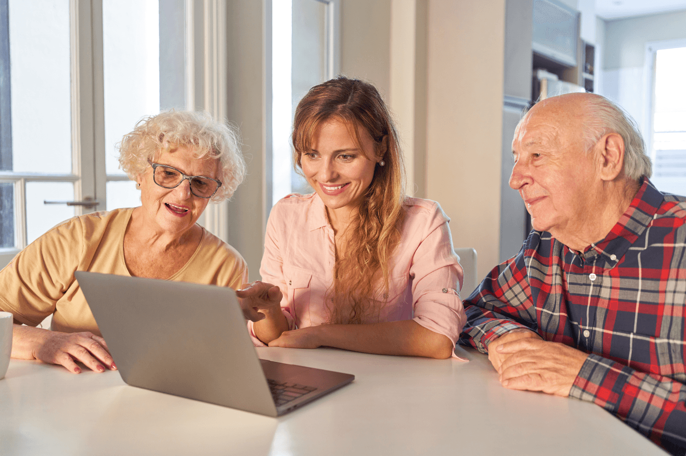 Daughter Helps Senior Parents with Laptop Computer