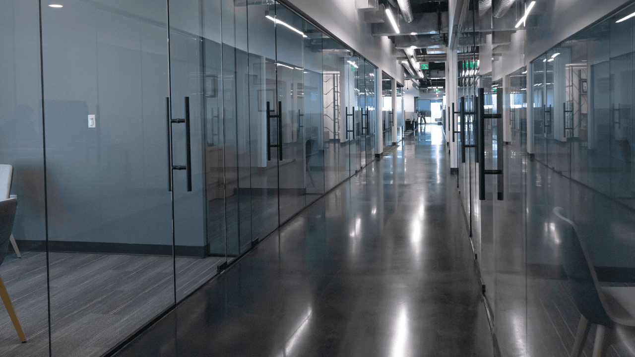 Polished concrete flooring in a modern office hallway