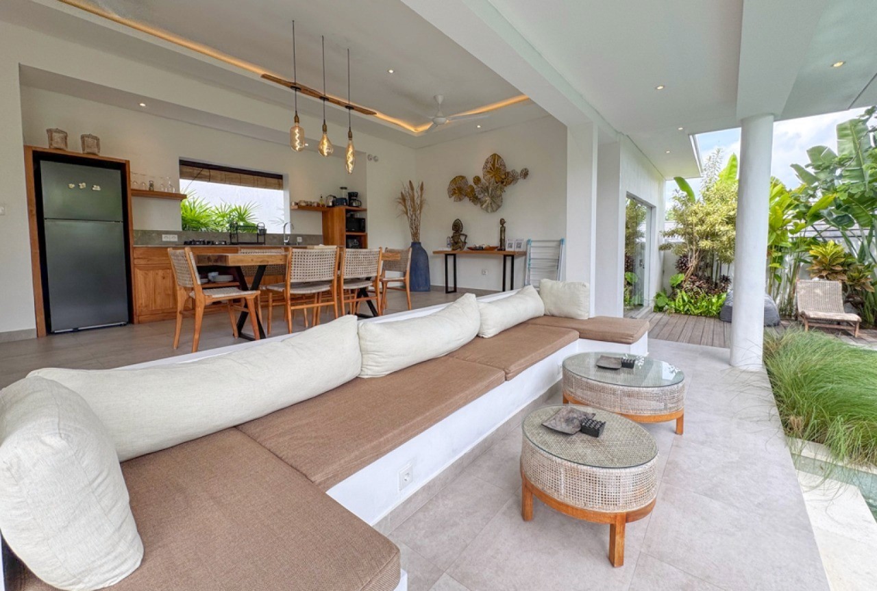 Spacious outdoor lounge in a Nyanyi Beach villa. Expert real estate guidance for high-end Bali property investments.