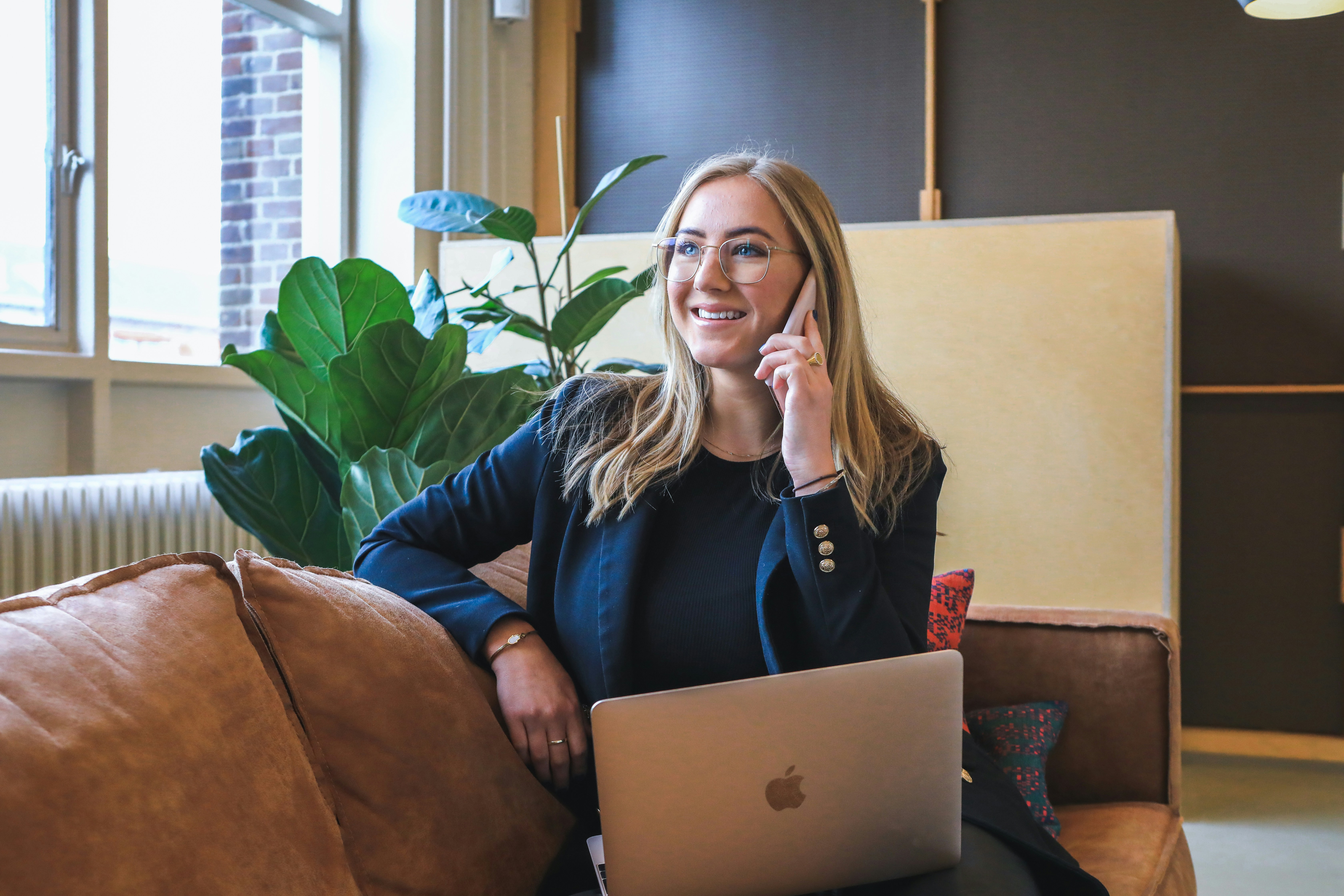 Woman on a phone call getting prospect contacts