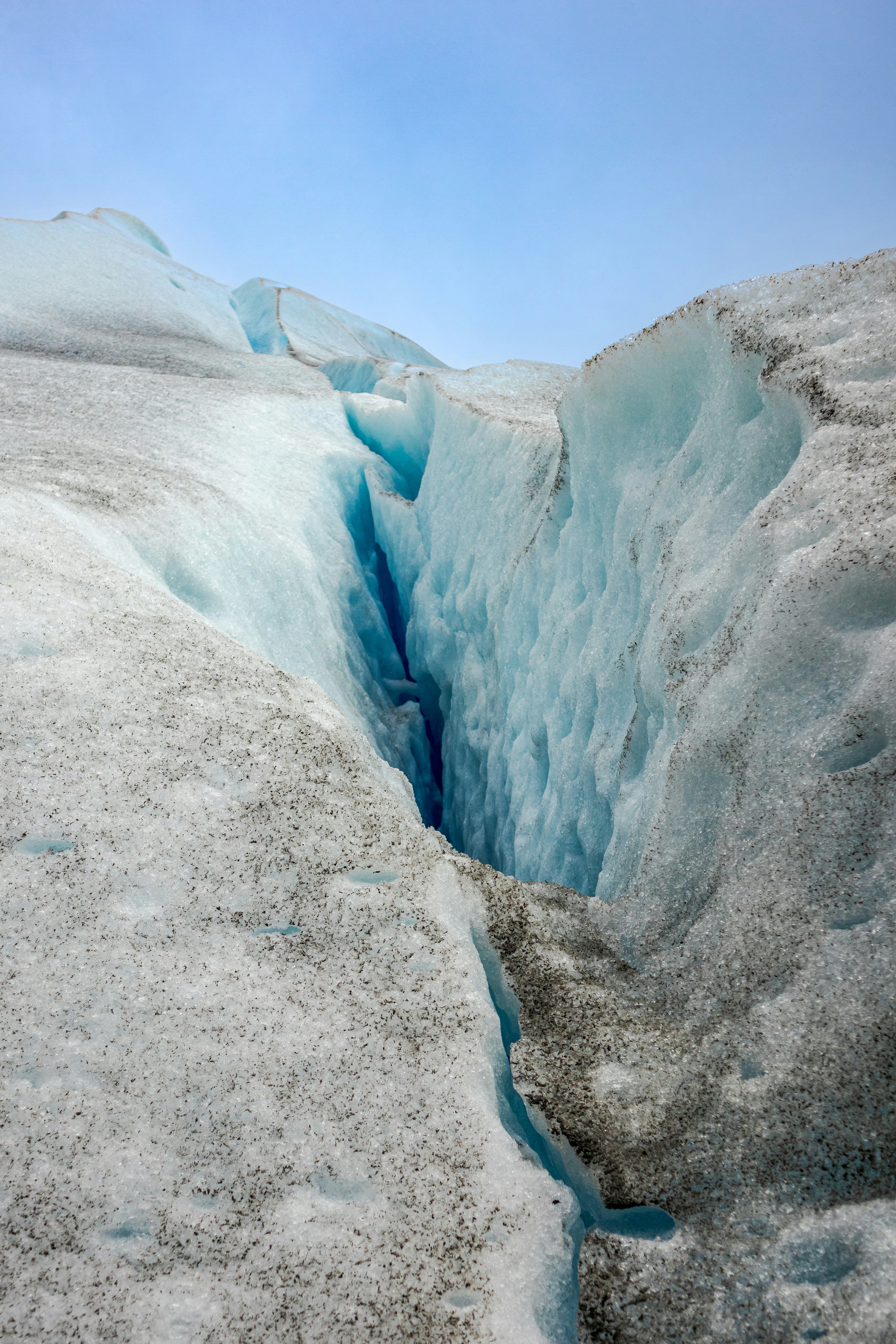 A crack in the ice with a sky background