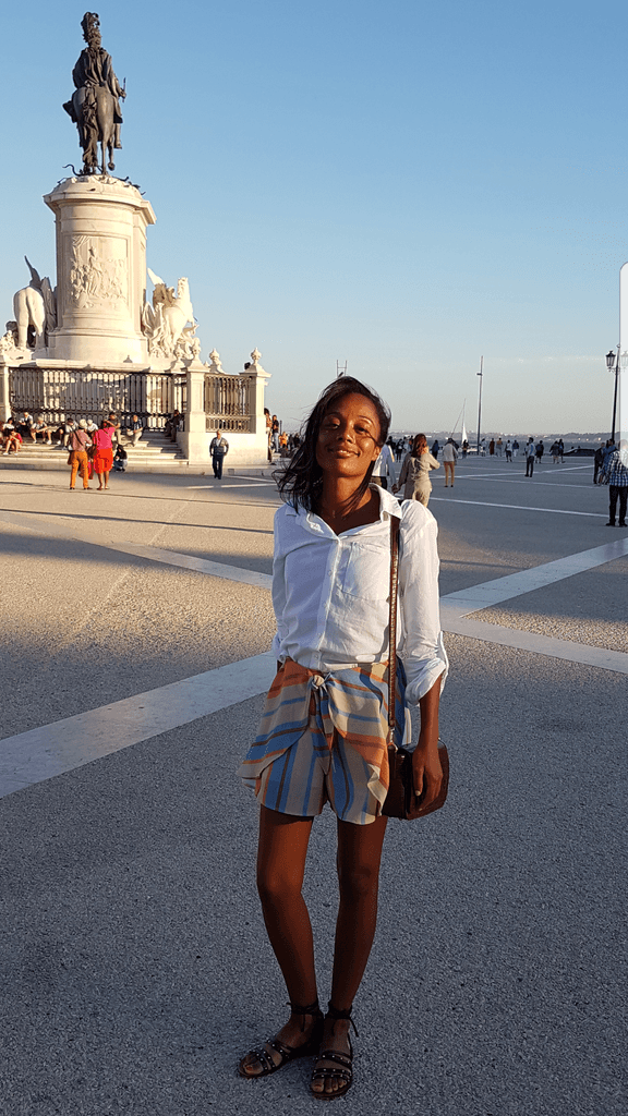 rita batalha standing in a public plaza