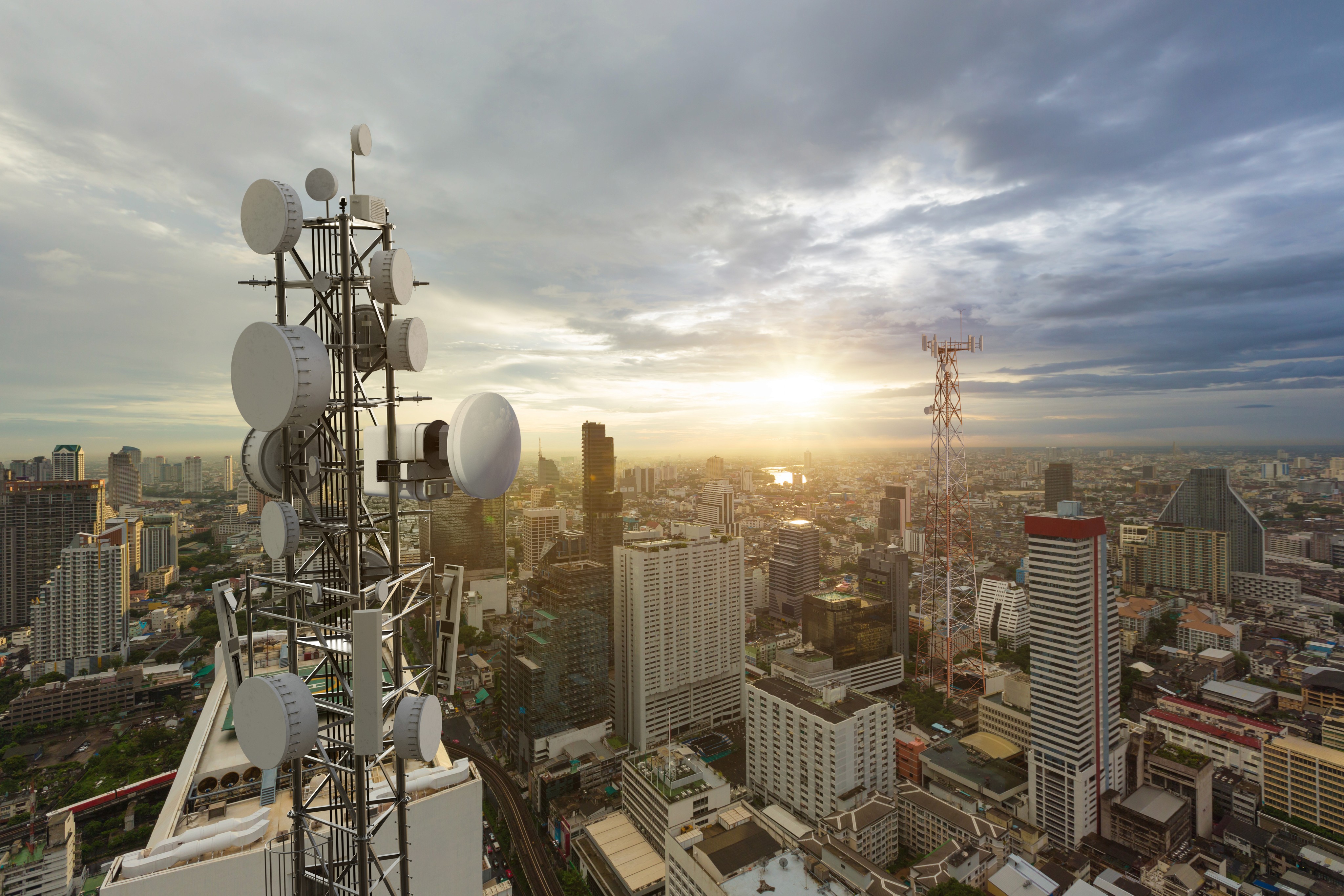acculink dish on a telecoms tower in a city