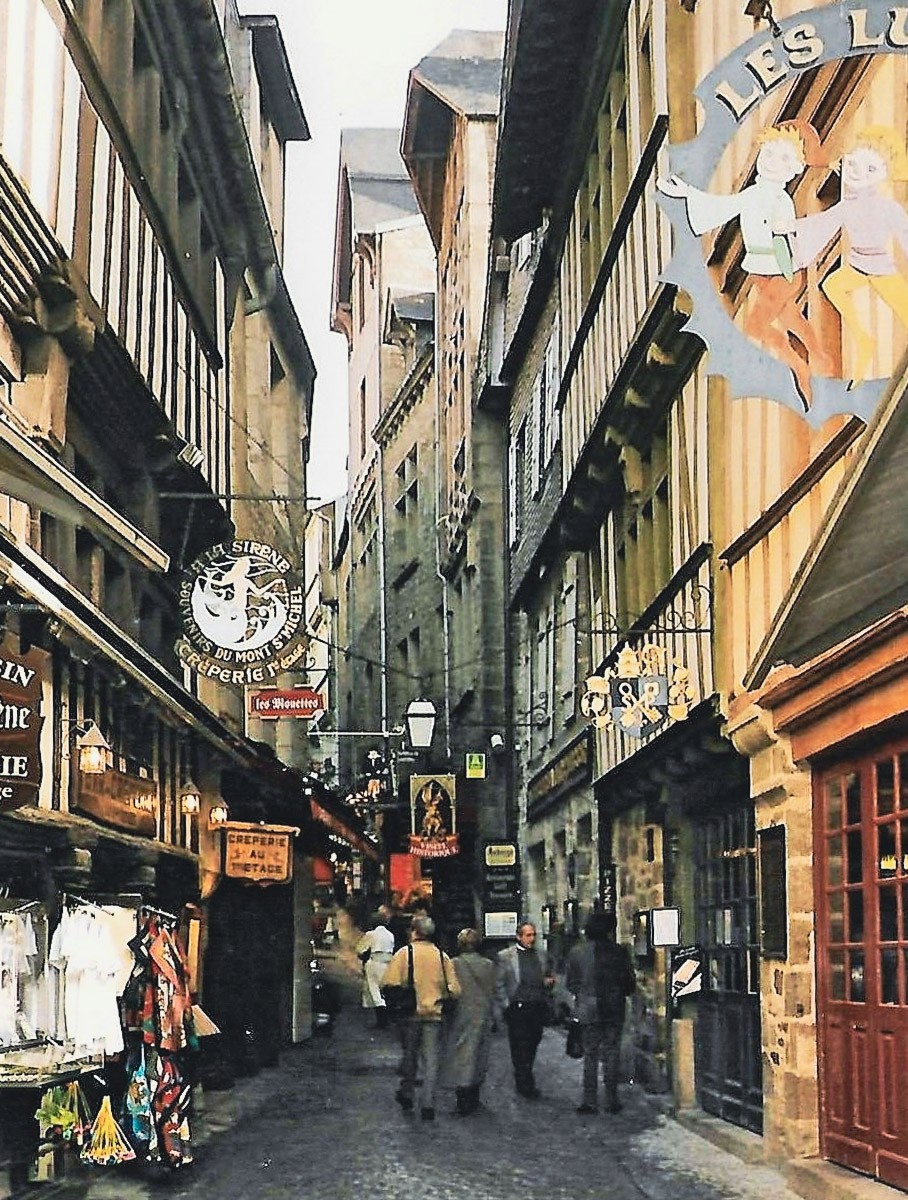 green grass field near white concrete building during daytime