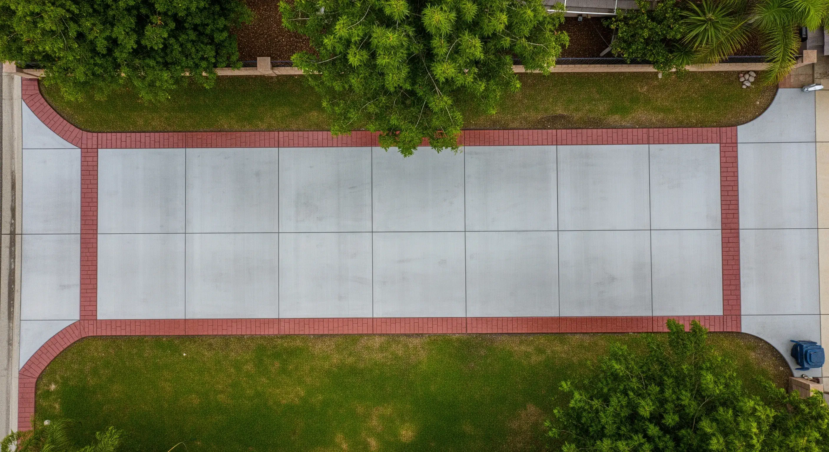 Decorative concrete driveway with colored concrete band