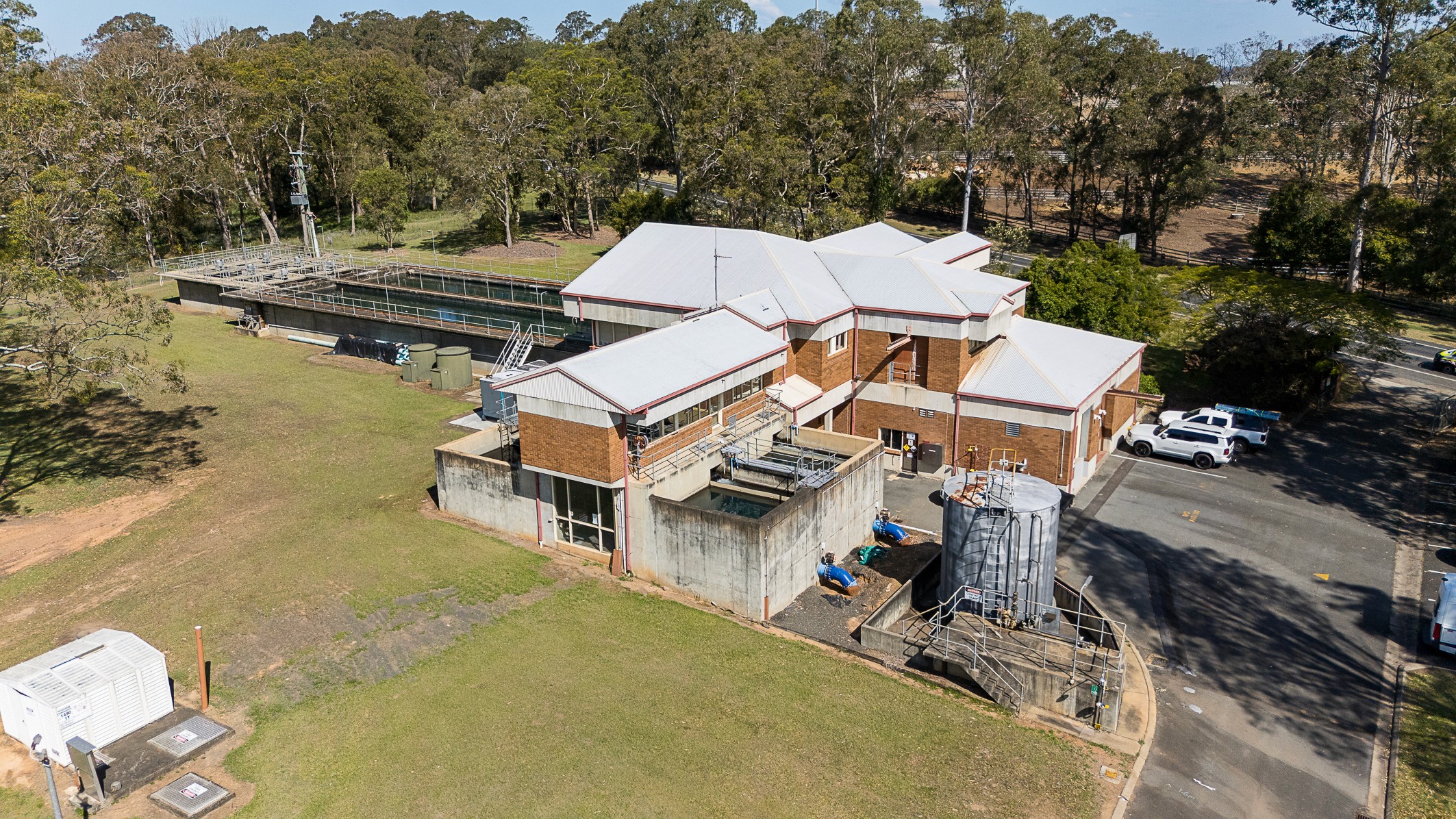 Completed sewage treatment plant facility integrated into the surrounding landscape, delivered through Uminex project management services