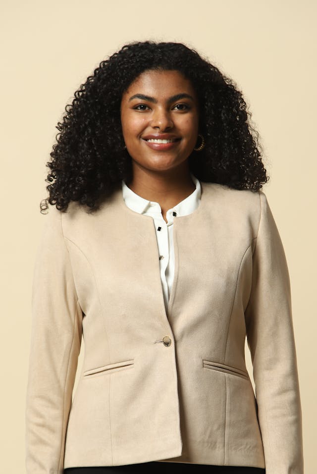 Elegant Professional Woman in Beige Blazer