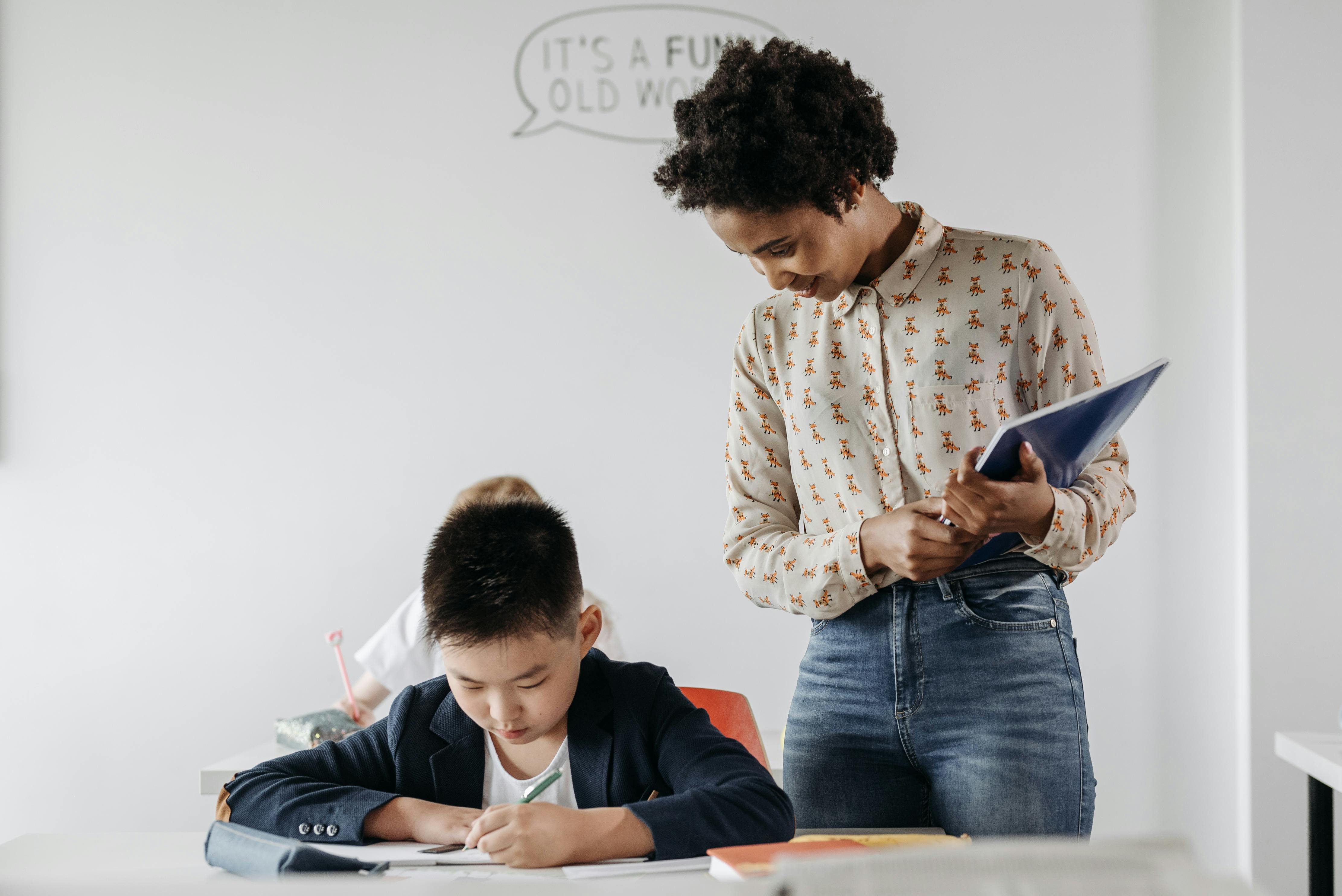 Foreign teacher tutoring a Chinese student in class