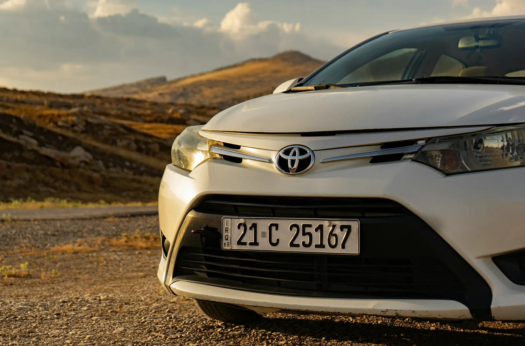 Car rental website visual showing a rental vehicle and online booking concept