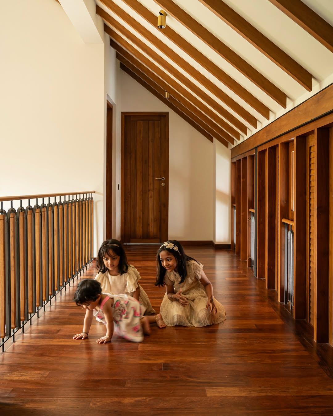 Modern sustainable townhomes surrounded by lush landscaping and a winding pathway.