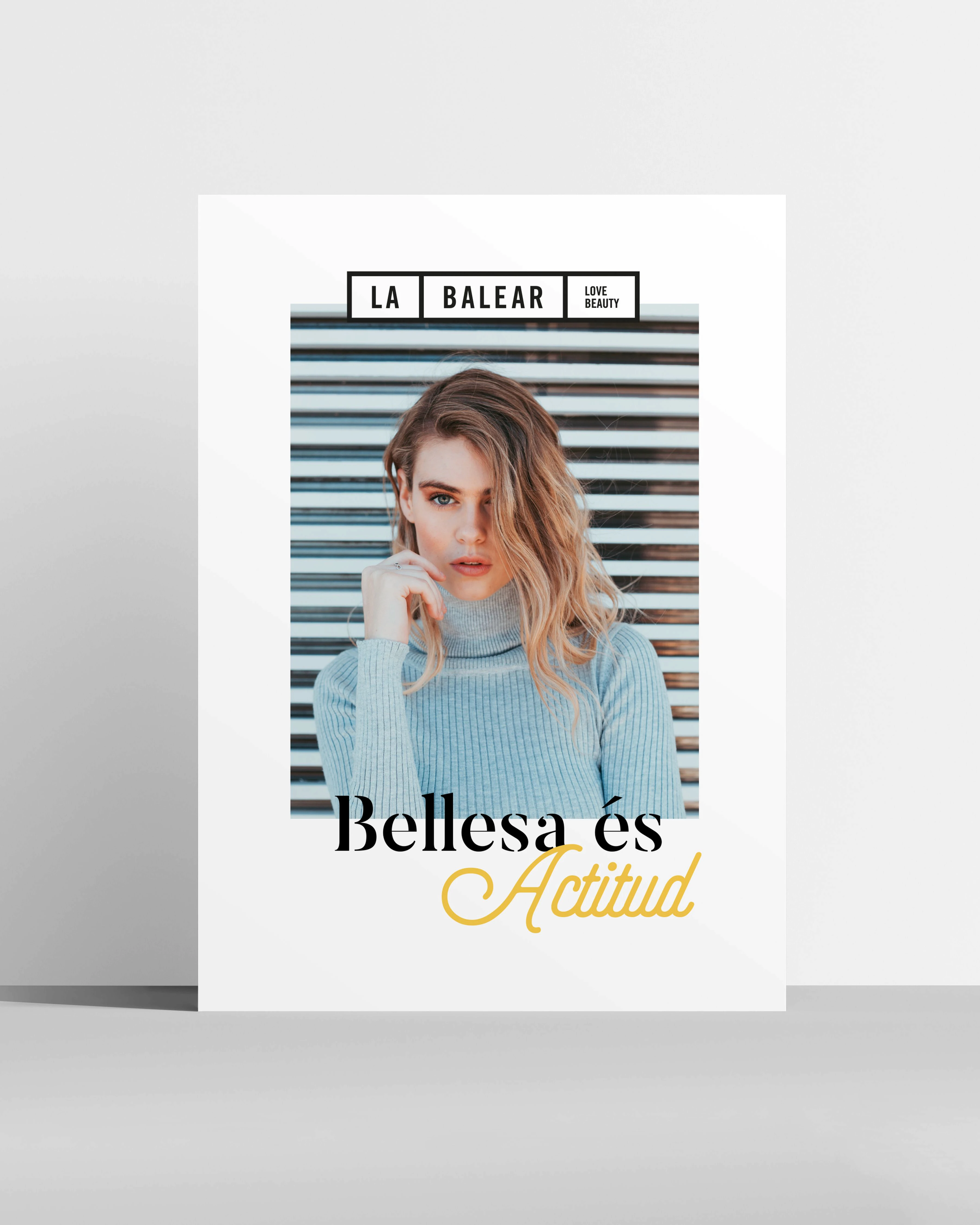 La Balear poster with a woman in a blue sweater reading 'Bellesa és Actitud', brand identity design by Sebastian Saavedra