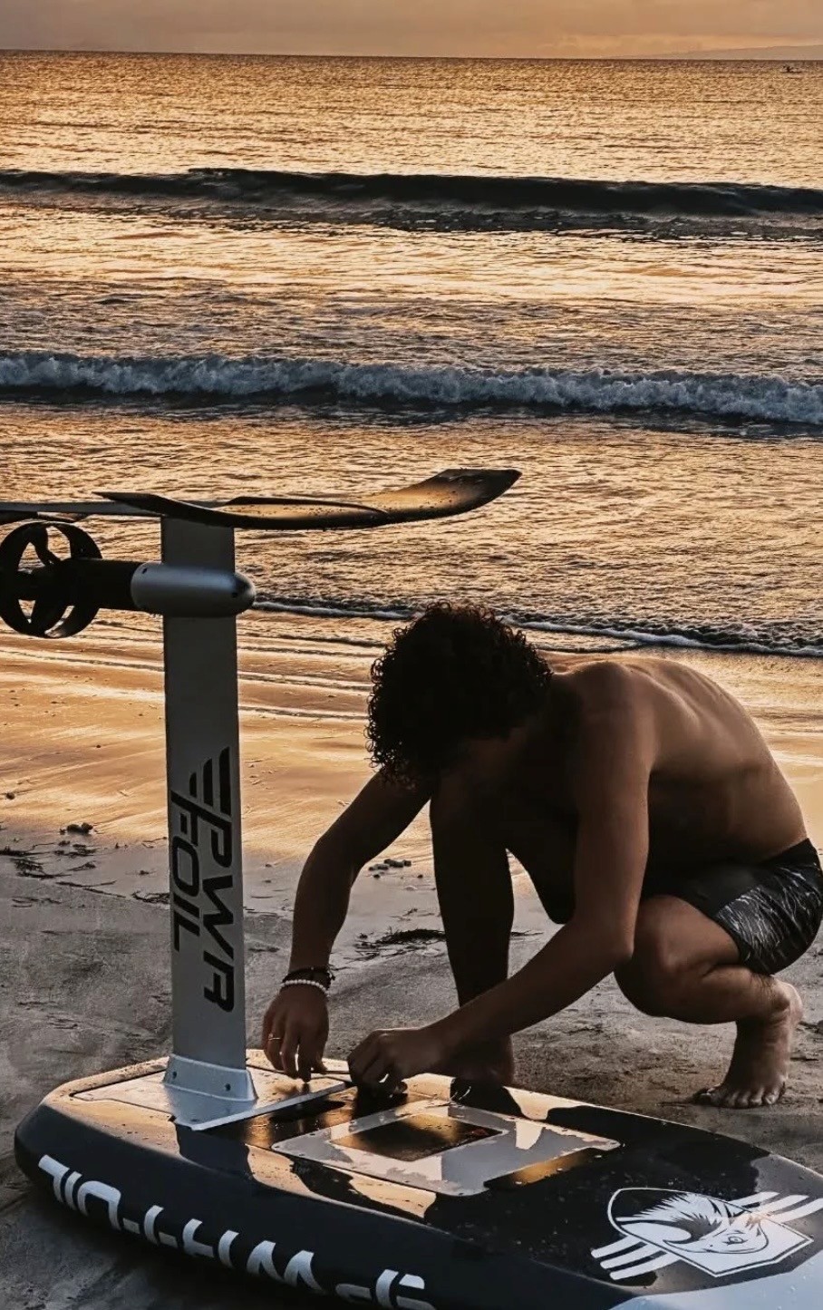 A man standing with Sufboard