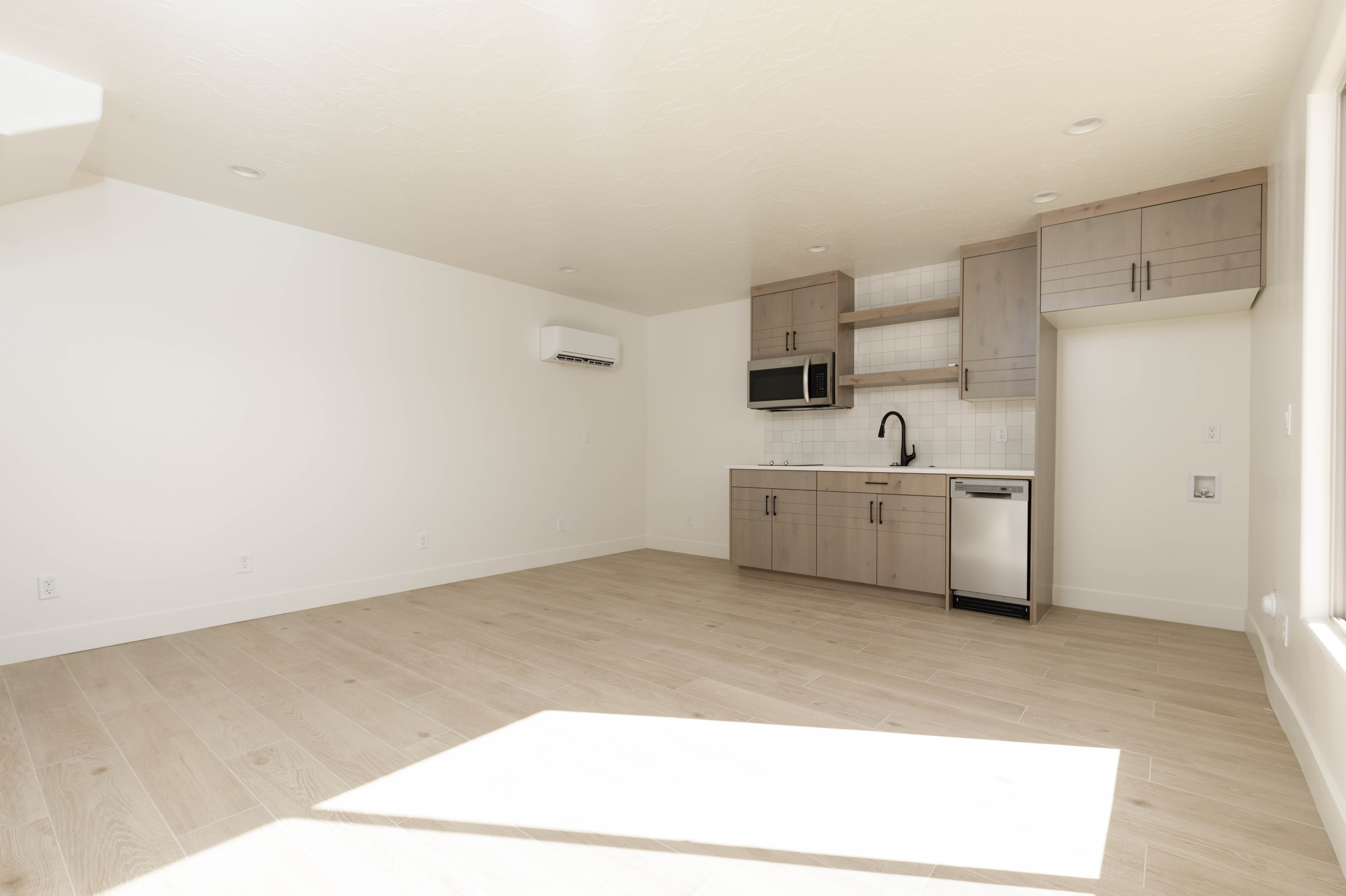Casita kitchenette with modern cabinetry in a Hurricane Utah home with separate guest entrance.