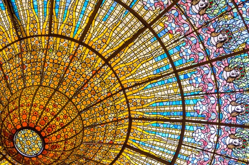 Colorful stained glass dome ceiling with intricate patterns.