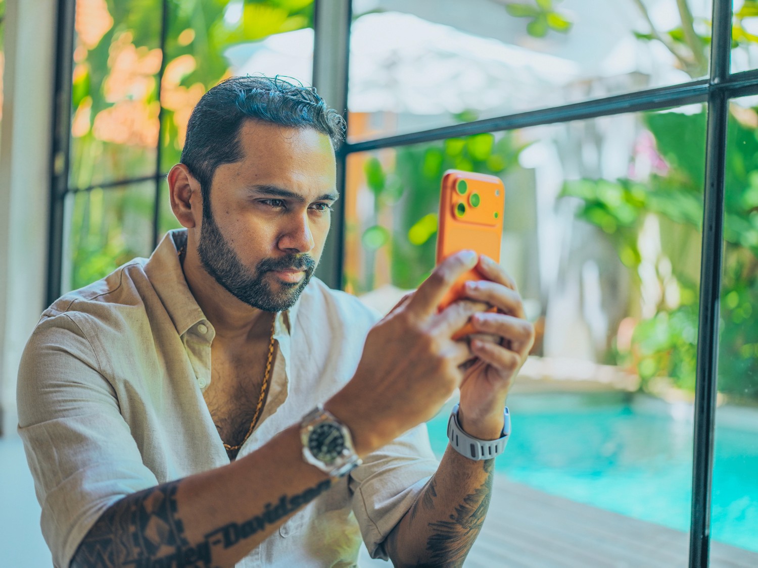 Close-up of a person wearing white triangle sunglasses on a teal background.
