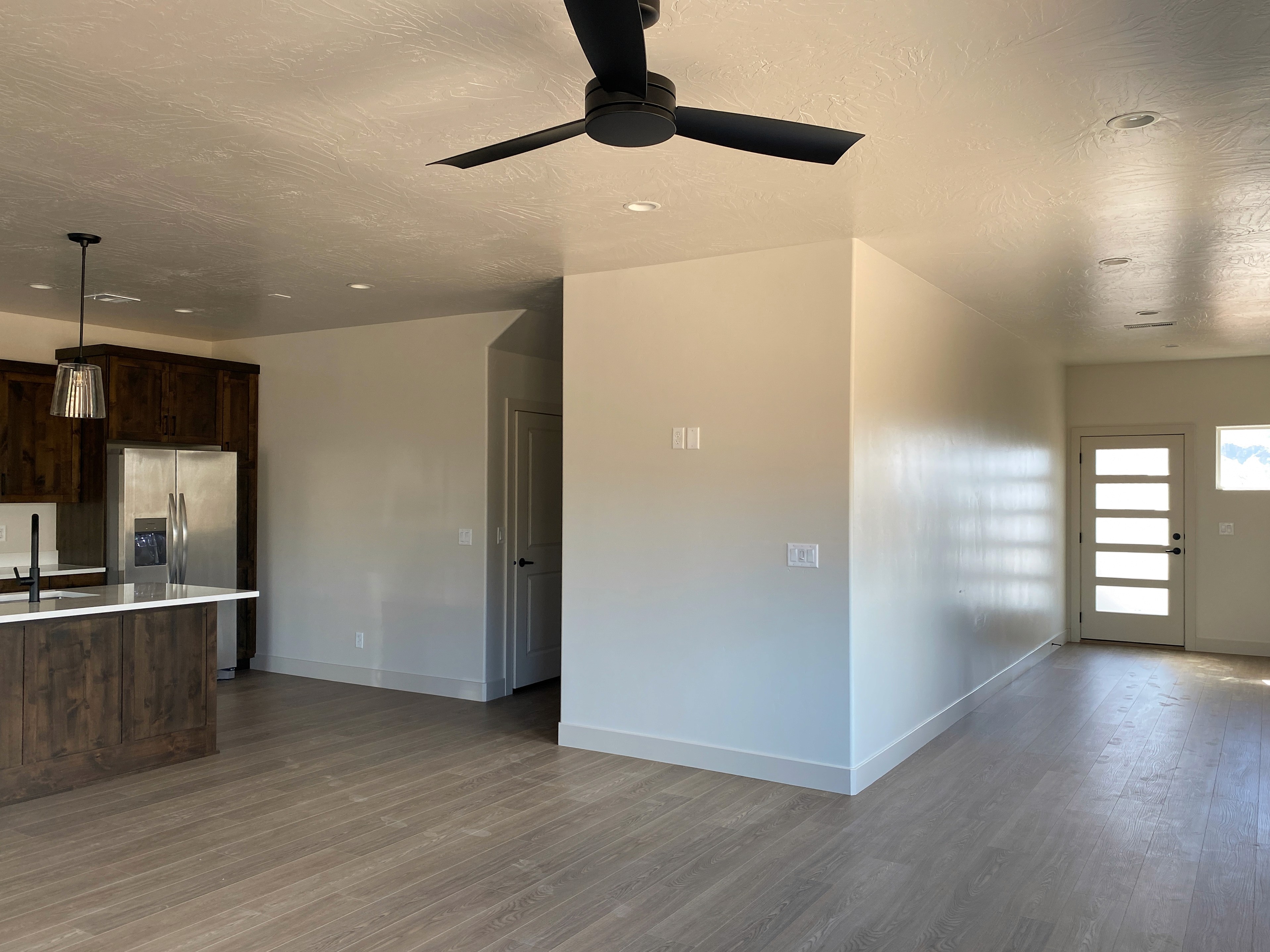 View from entry into kitchen in a Hurricane, Utah duplex with open layout design.