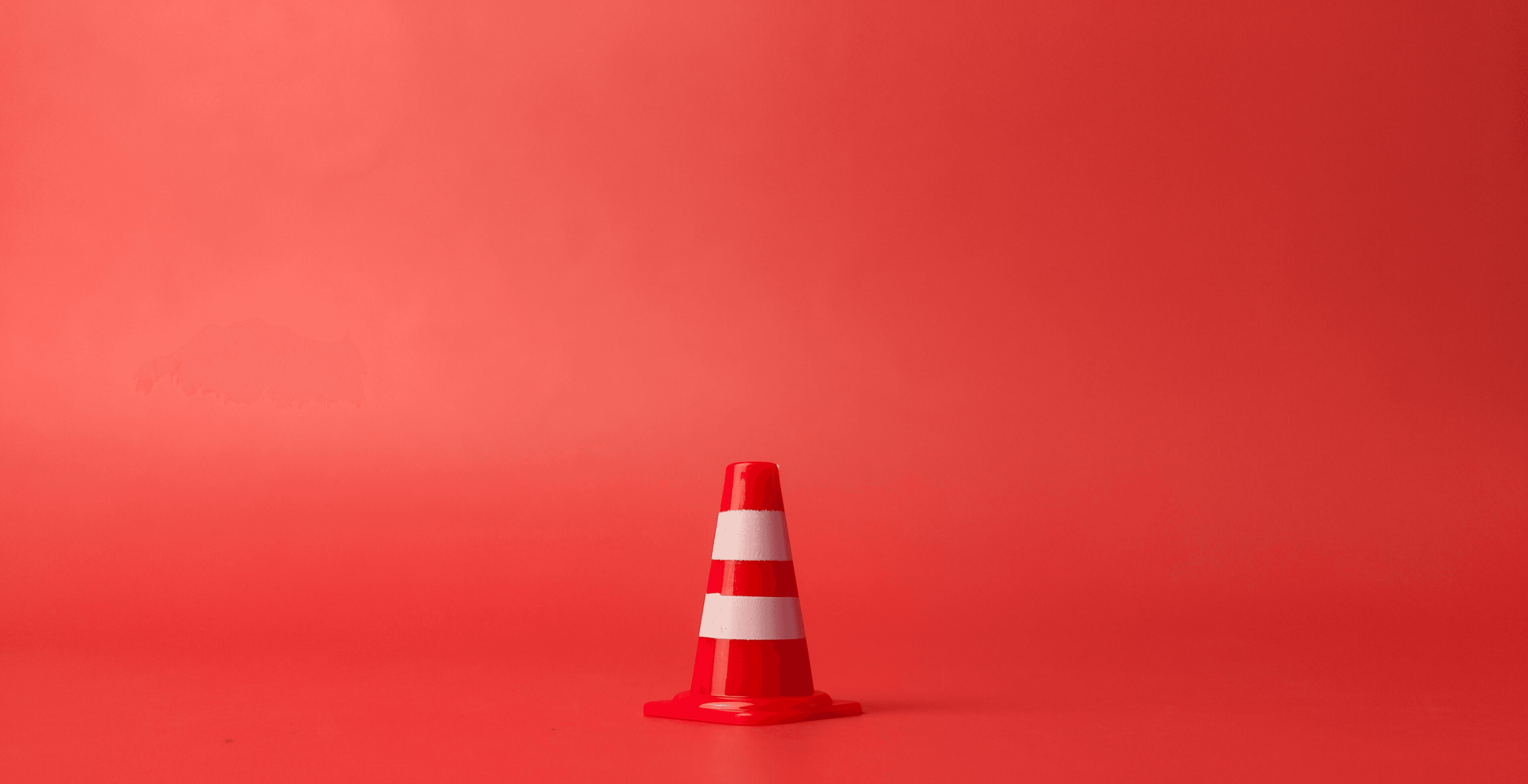 red flag on pole under blue sky during daytime