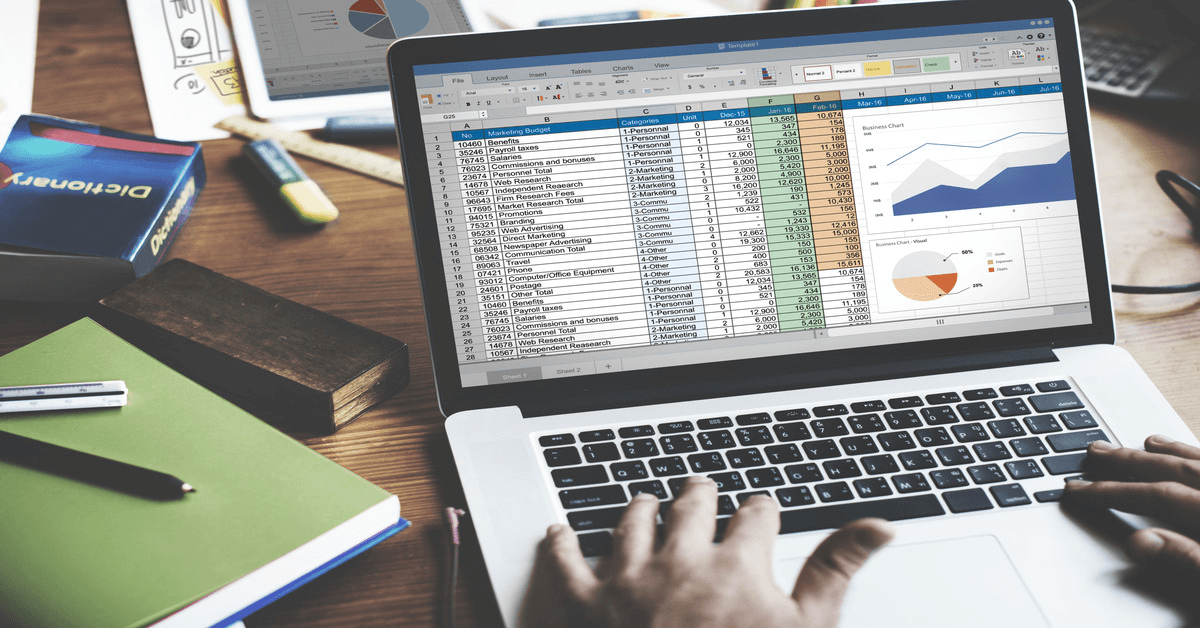 Laptop showing spreadsheet with data charts - How to add VBA to Excel