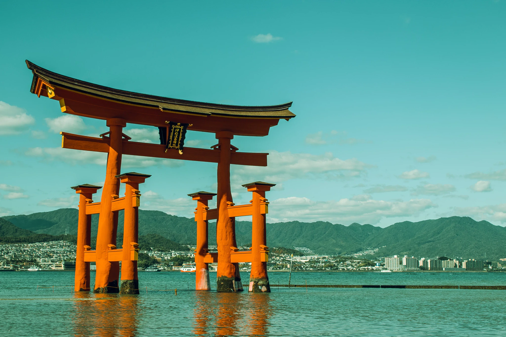 Itsukushima shrine Torii in the middle of the sea and its reflection
