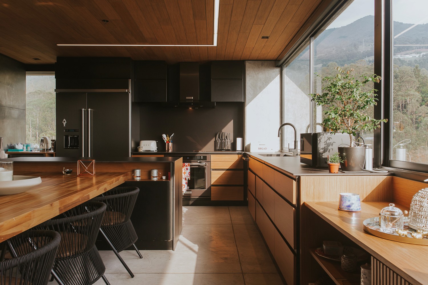 Double-height interior with flowing sculptural forms and warm raking light