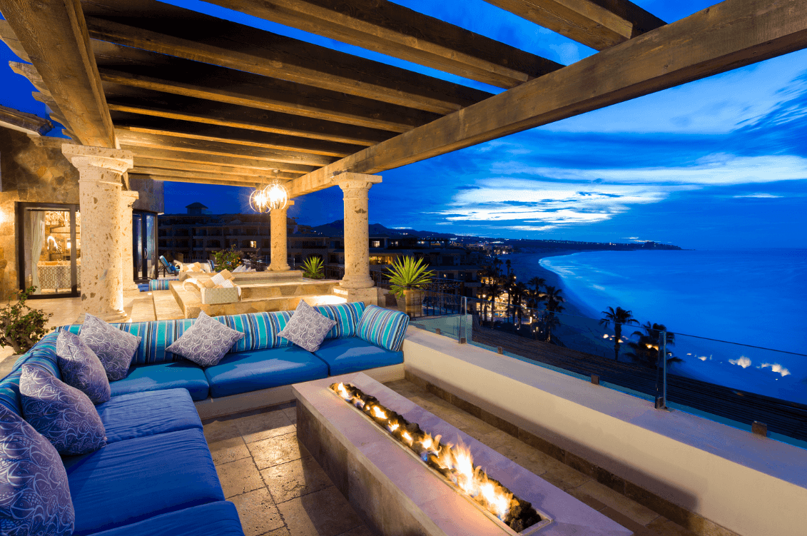 Terrace seating and fire feature at dusk.