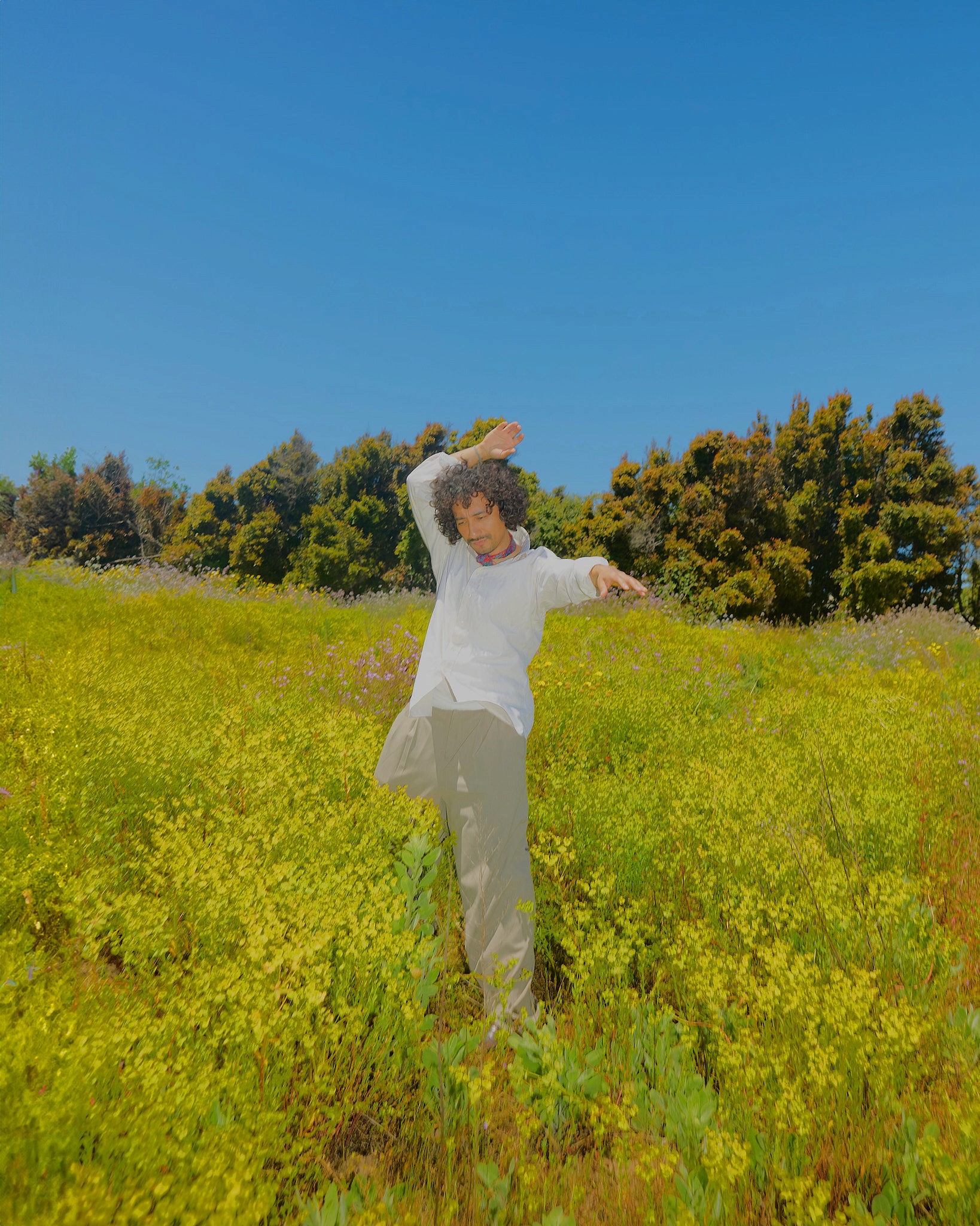 Woman with red hair covering mouth with hair