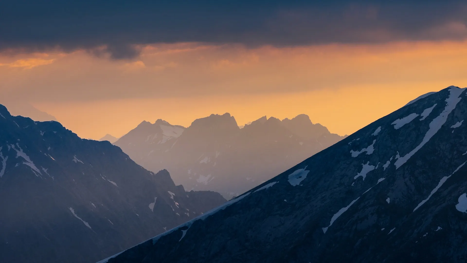 A view of a mountain range at sunset.
