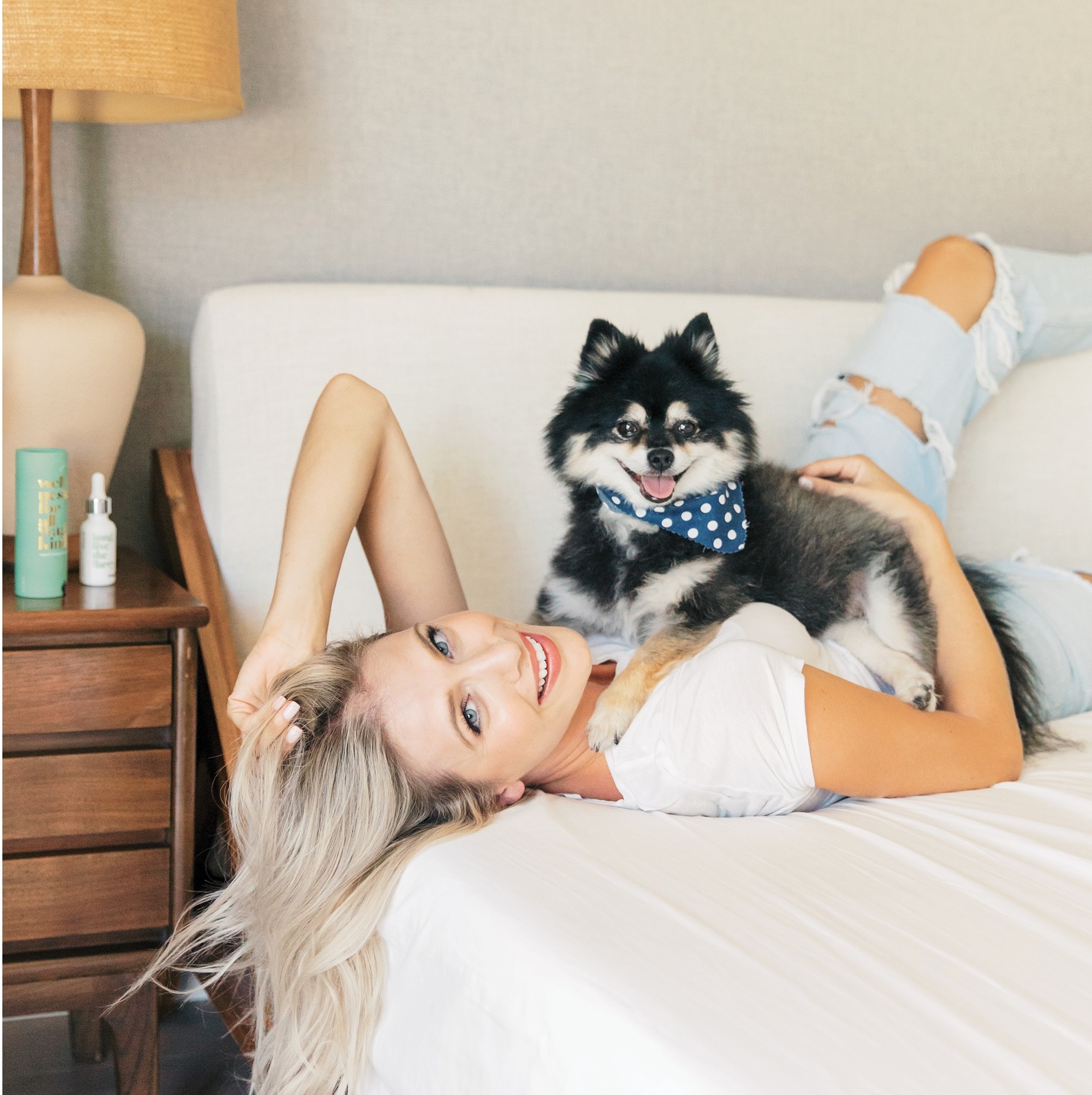 Stacked pink and red glass cosmetic jars on white—minimal skincare packaging display.