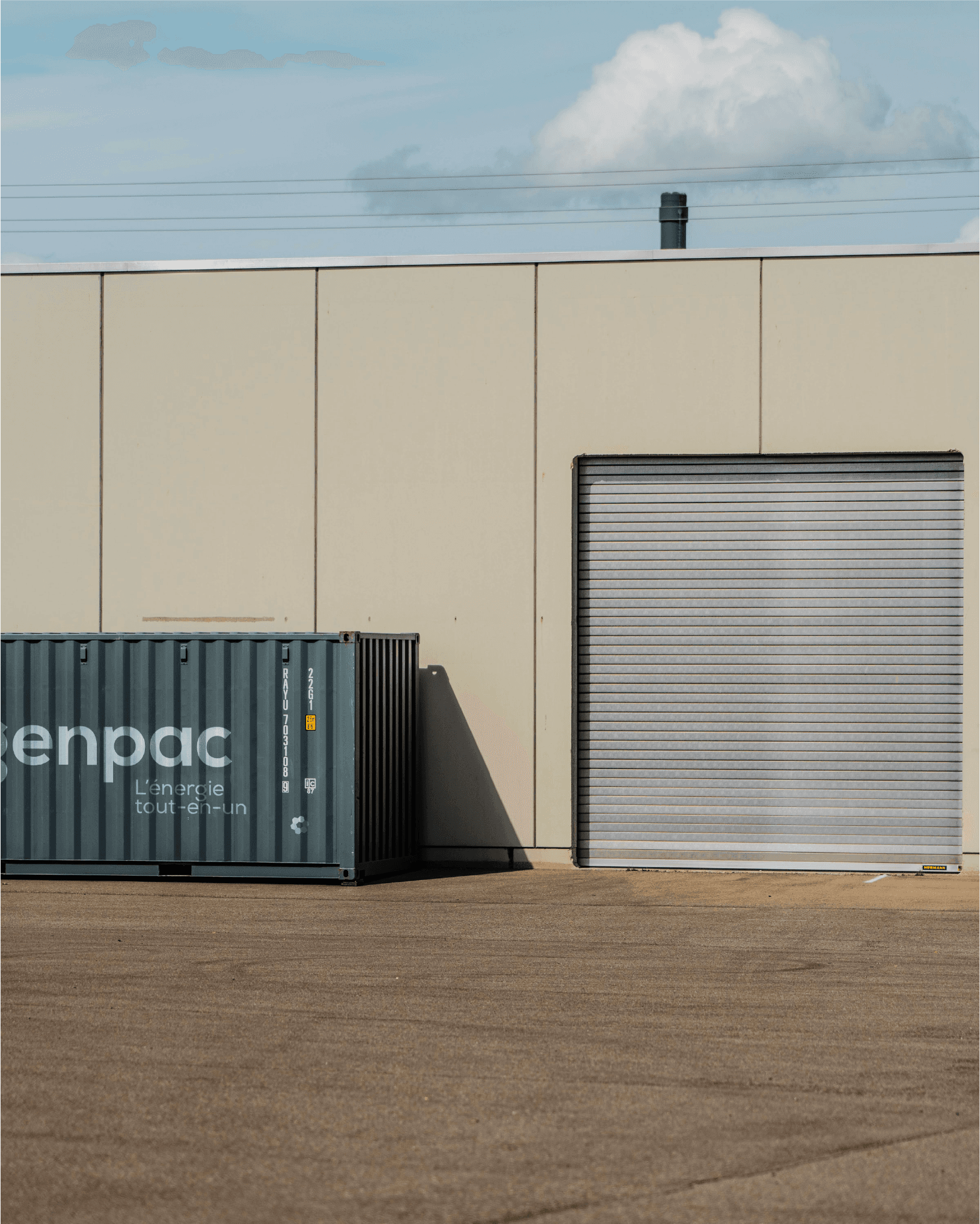 Modern home office setup with a monitor, ergonomic chair, keyboard, and indoor plants near a window with blinds.