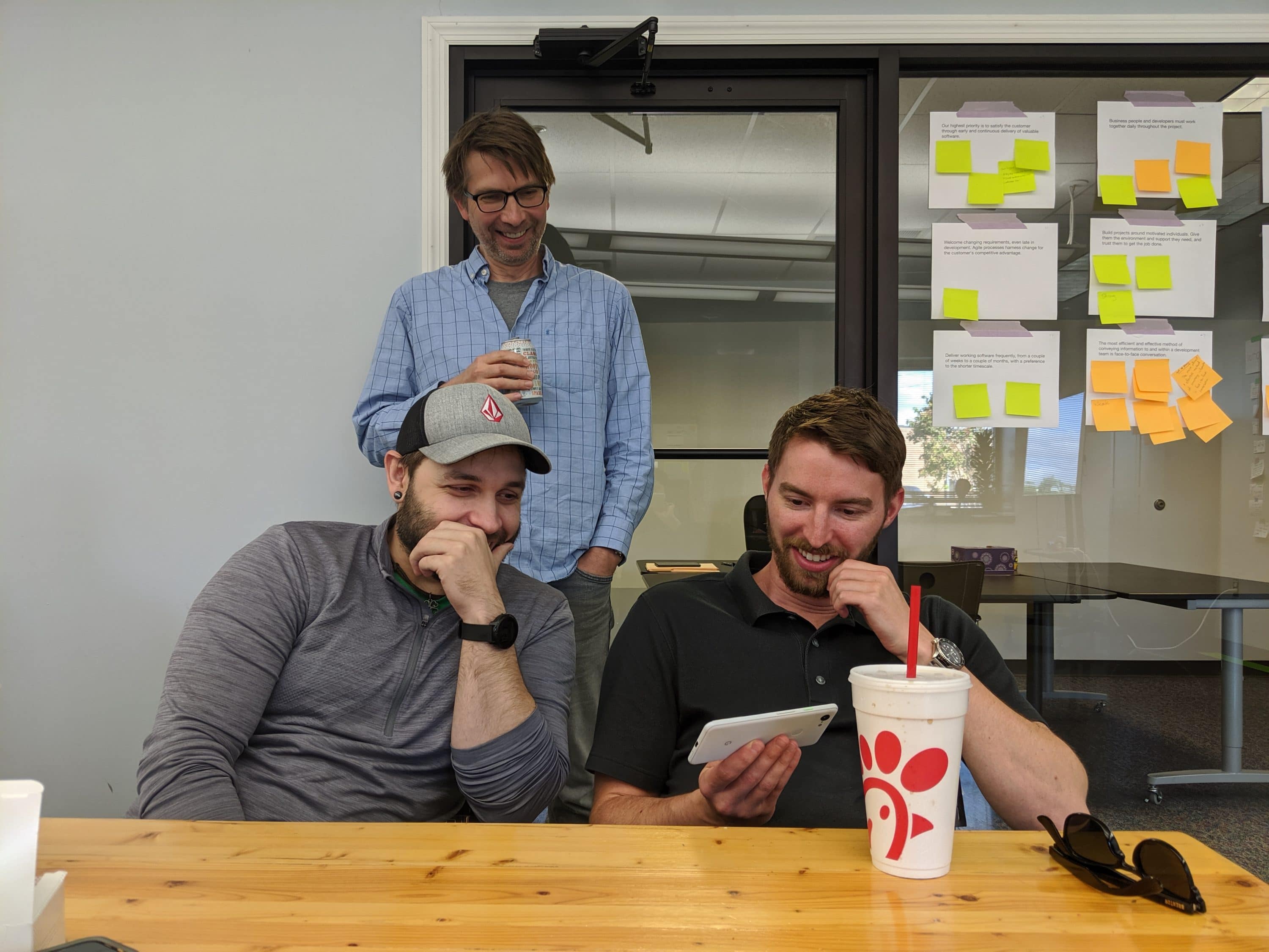 Smart Data Employees in the office having fun watching a video