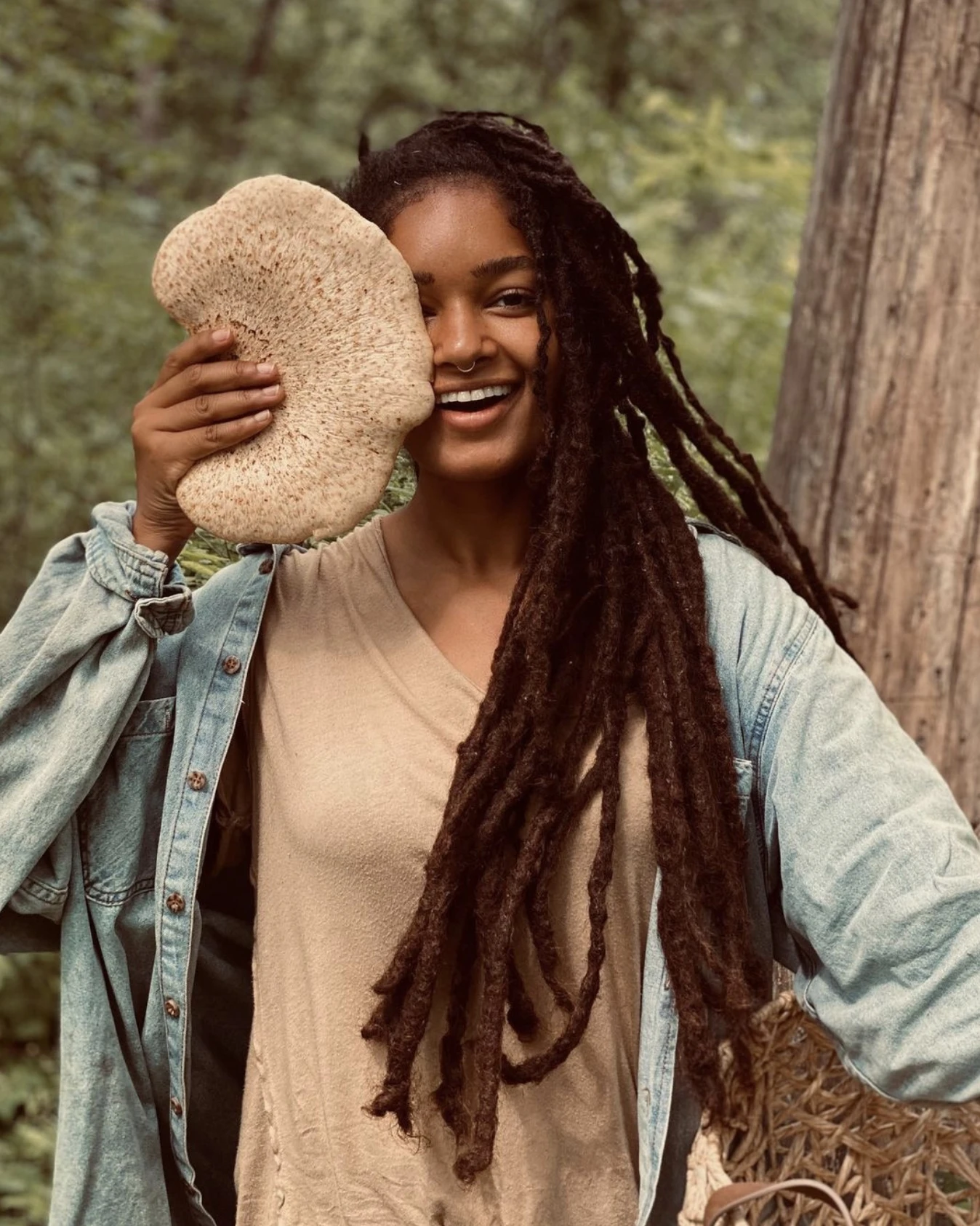 Someone taking a photo of a woman on a phone.