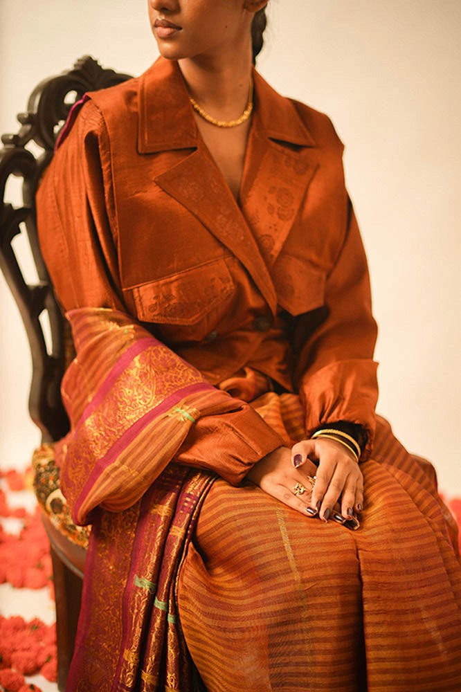 AMBR is our one-of-a-kind cropped two-toned silk brocade reversible bomber, handcrafted by skilled artisans in-house using two vintage silk saris.