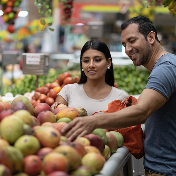 image of couple shopping with a reusable tote bag made from recycled material