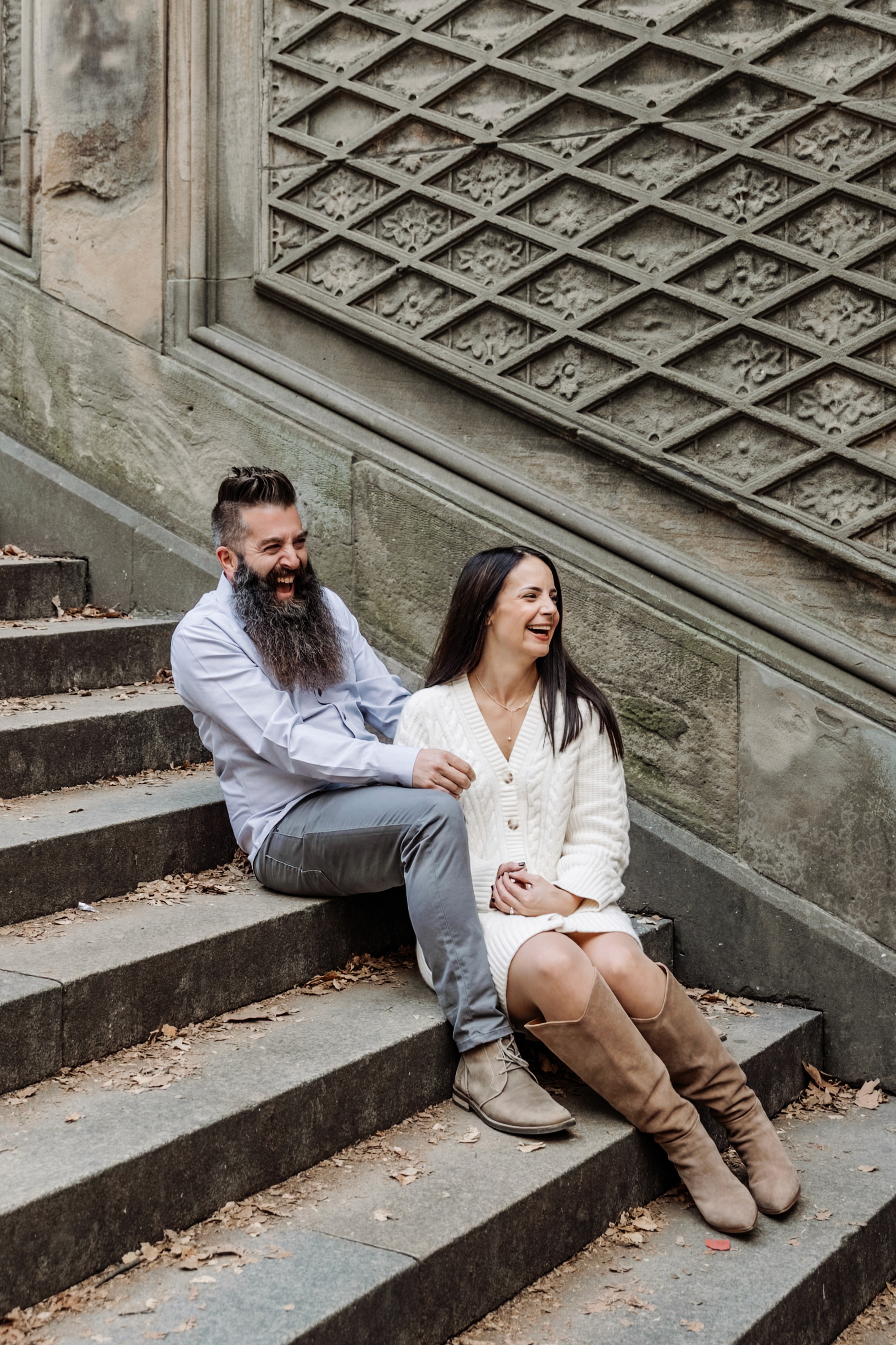 4:59 PMCouple caught in a genuine laugh on the stairs at Bethesda Fountain in Central Park, NYC — fun, unposed couples photography by Lizz Spano Photography, New York City couples photographer.
