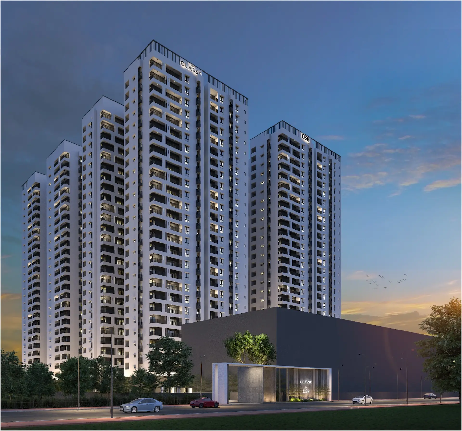 A person sits at a cluttered desk in a dimly lit room, focused on two monitors displaying aerial maps. The walls are covered with various images and notes.