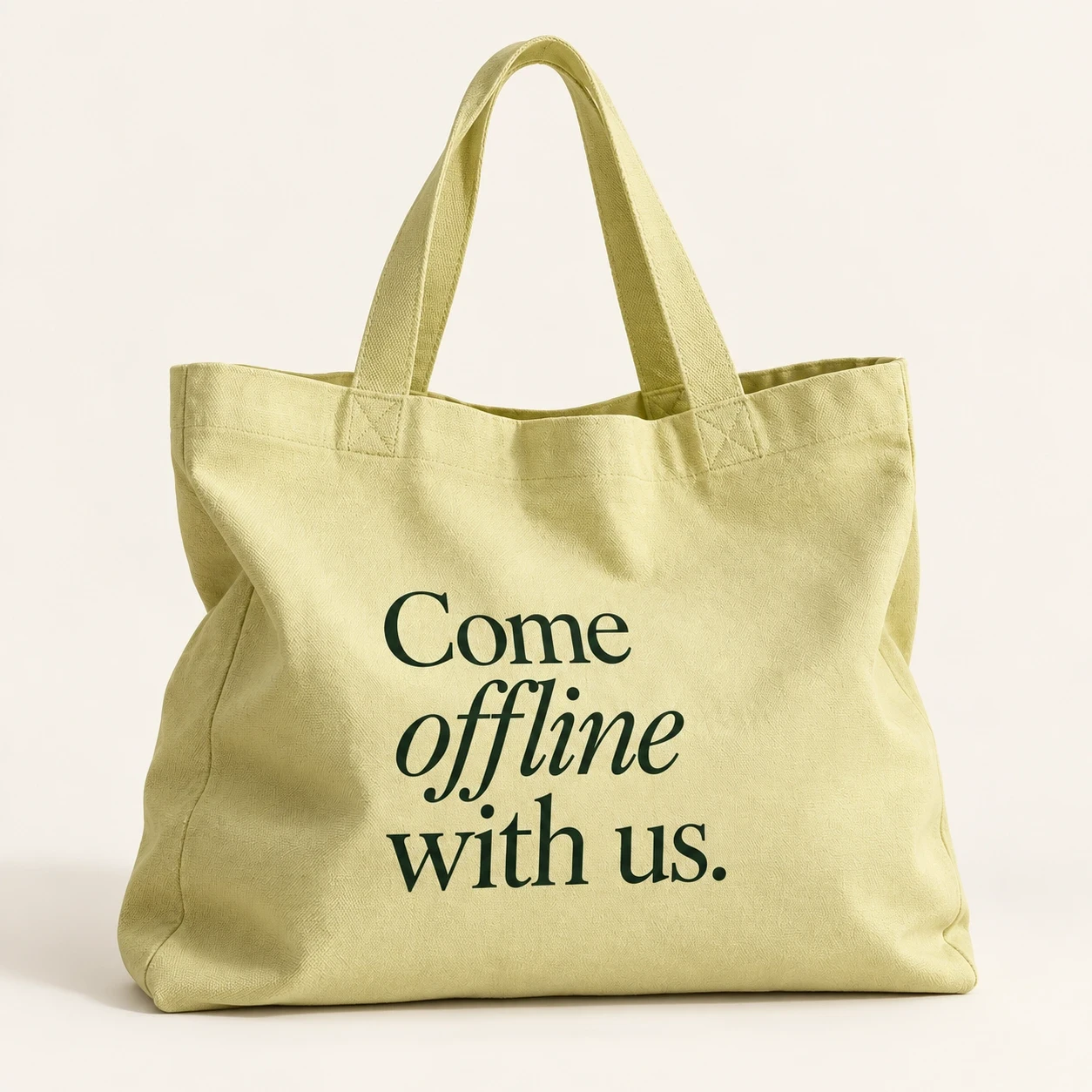 Soft citron canvas tote with Come offline with us in forest green.