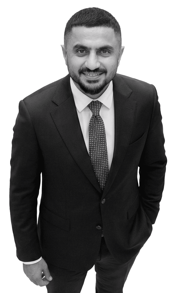 Professional woman in a suit standing in an office setting.