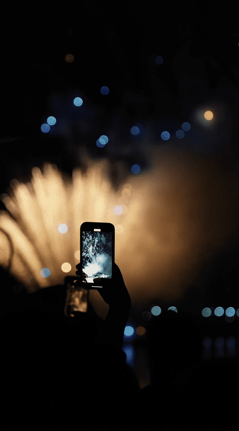Dancer in black outfit with one leg raised behind