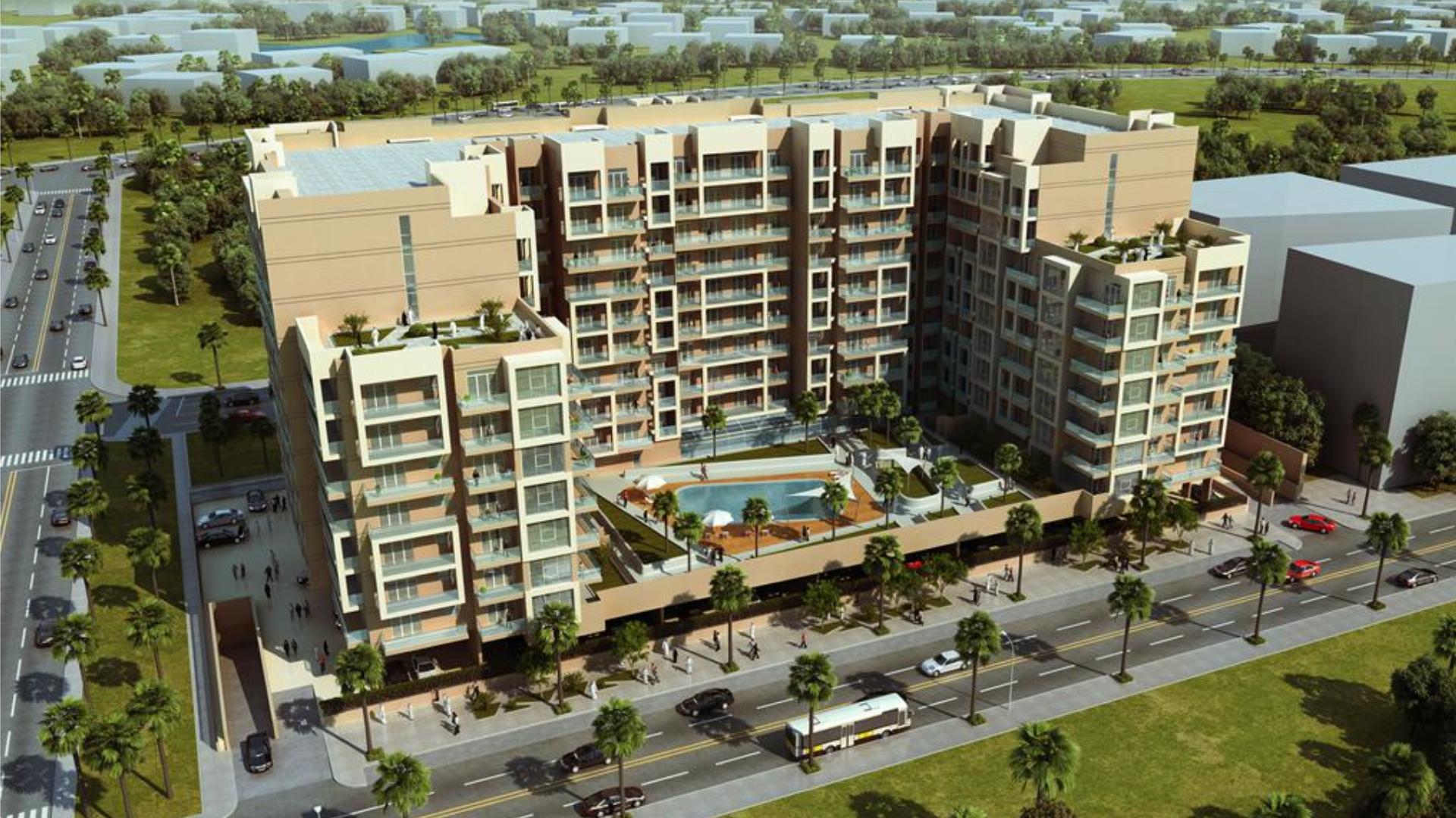 A landscaped walkway with palm trees and retail shops, highlighting the lifestyle within the Majan community.